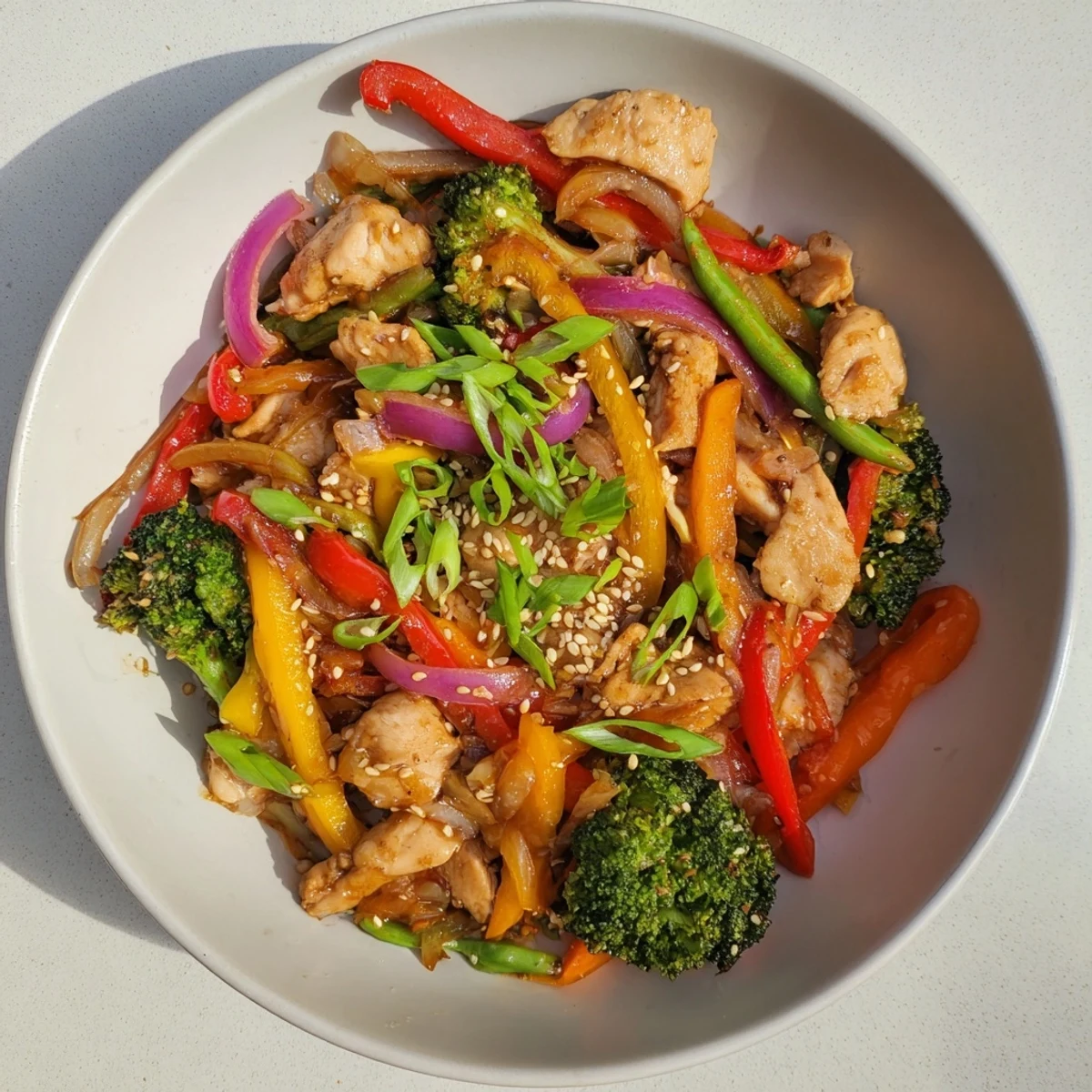Sheet Pan Chicken Stir-Fry with colorful vegetables, ready to serve over fluffy rice, a complete meal.