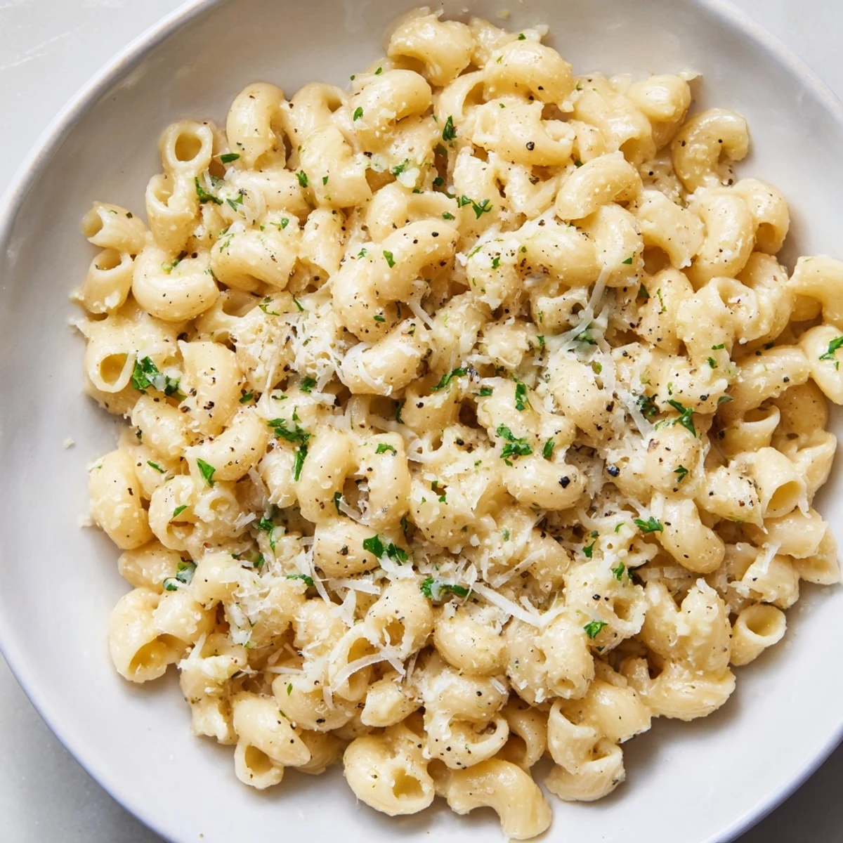 A close-up of steaming 15-Minute Creamy Garlic Butter Ditalini, coated in a rich, Parmesan-laced sauce.