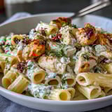 Savory Creamy Lemon Feta Chicken Pasta served steaming hot, garnished with fresh parsley and extra feta for a delicious weeknight dinner.