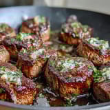 Savory steak cubes tossed in garlic butter and fresh herbs for a quick, flavorful summer dinner.