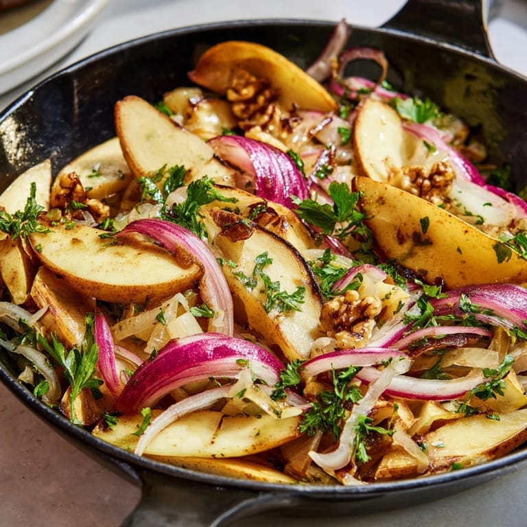 Serving suggestion for Warm Apple and Sauerkraut Skillet Salad, paired with grilled kielbasa and a dollop of sour cream.